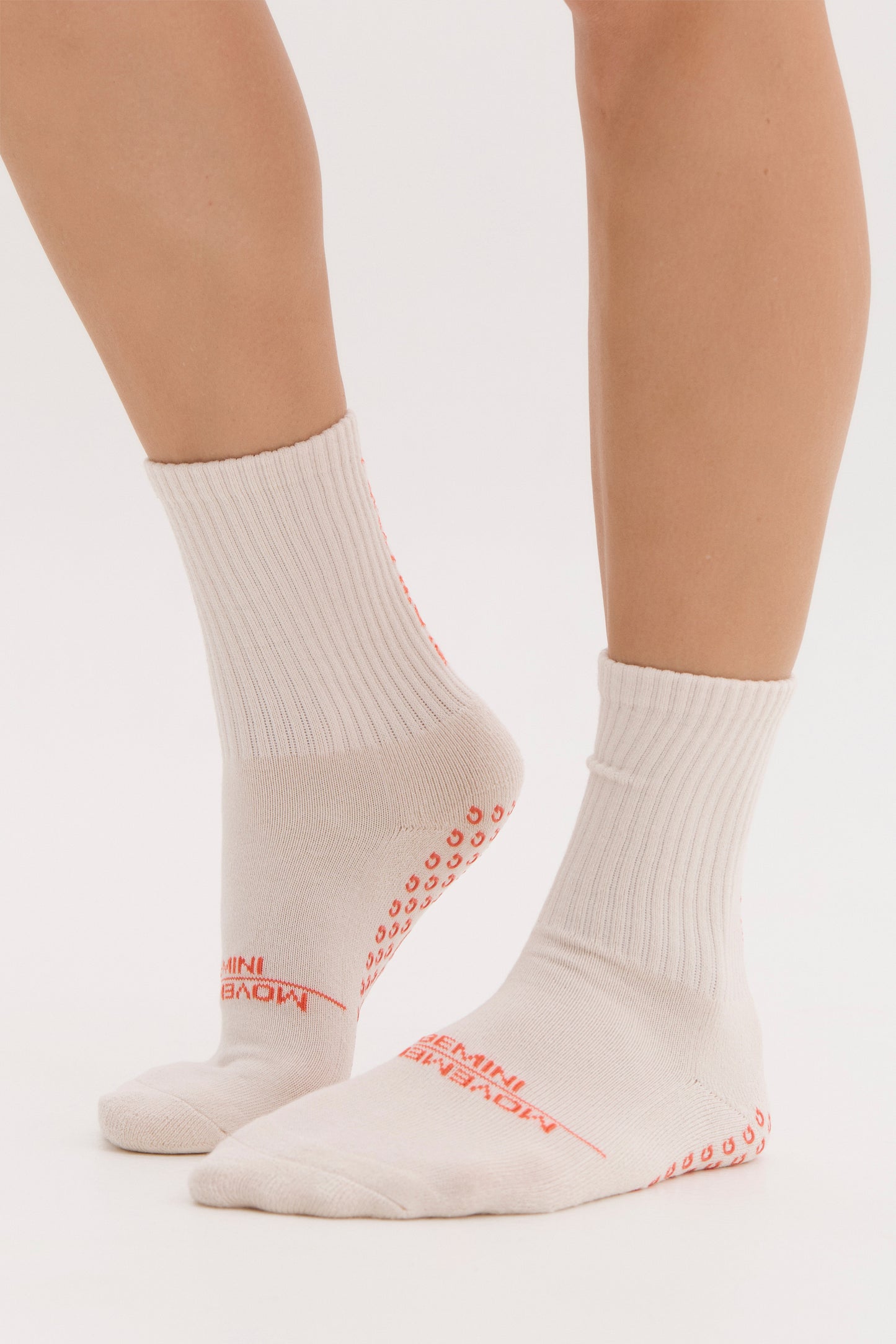 
                  
                    breathable cream pilates grip socks with red detailing
                  
                