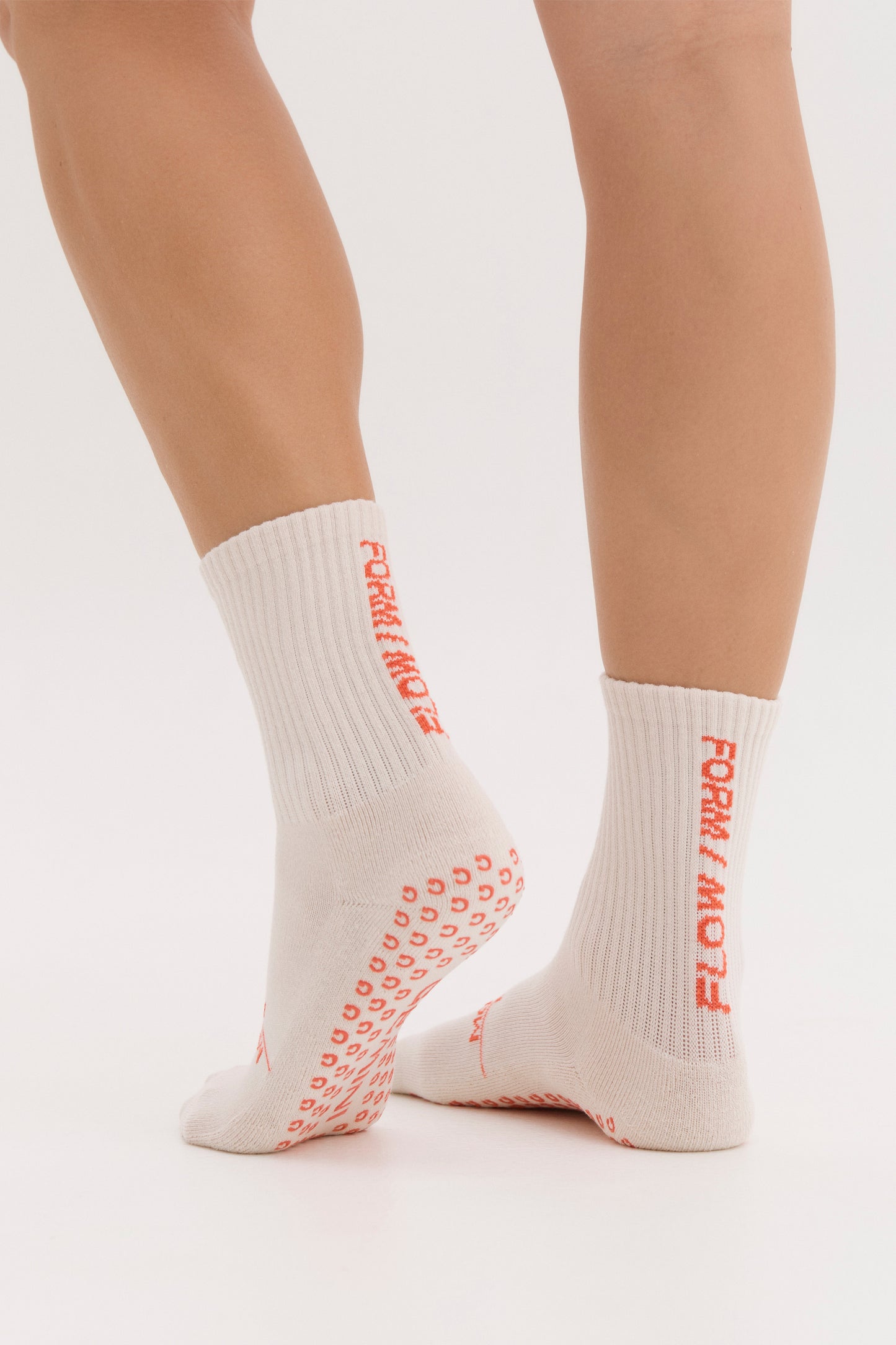 
                  
                    unisex cream pilates grip socks with red non slip sole
                  
                